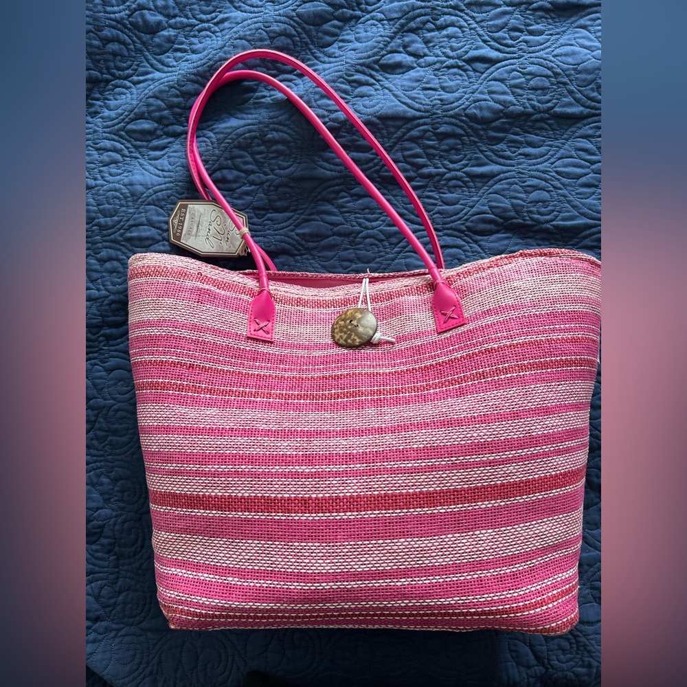 Brand new Sun N Sand beach bag in shades of pink.  Large bag.  Pockets inside.